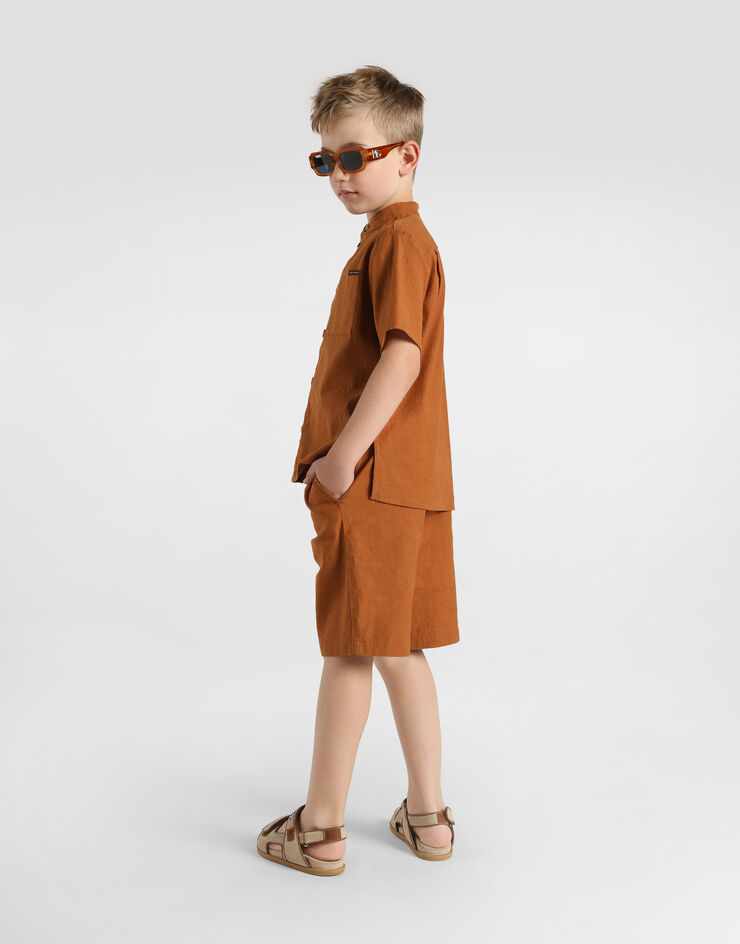 Dolce & Gabbana Cotton and linen canvas bermuda shorts Beige L43Q58LT372