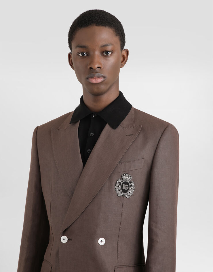 Dolce & Gabbana Zweireihige Jacke aus Leinen mit Patch Braun G2TJ2ZFU4LF