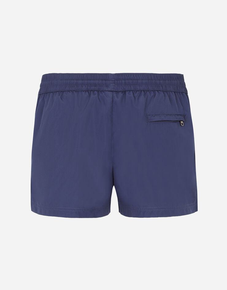 Dolce & Gabbana Boxer da mare corto con placchetta logata Blu M4B11TFUSFW