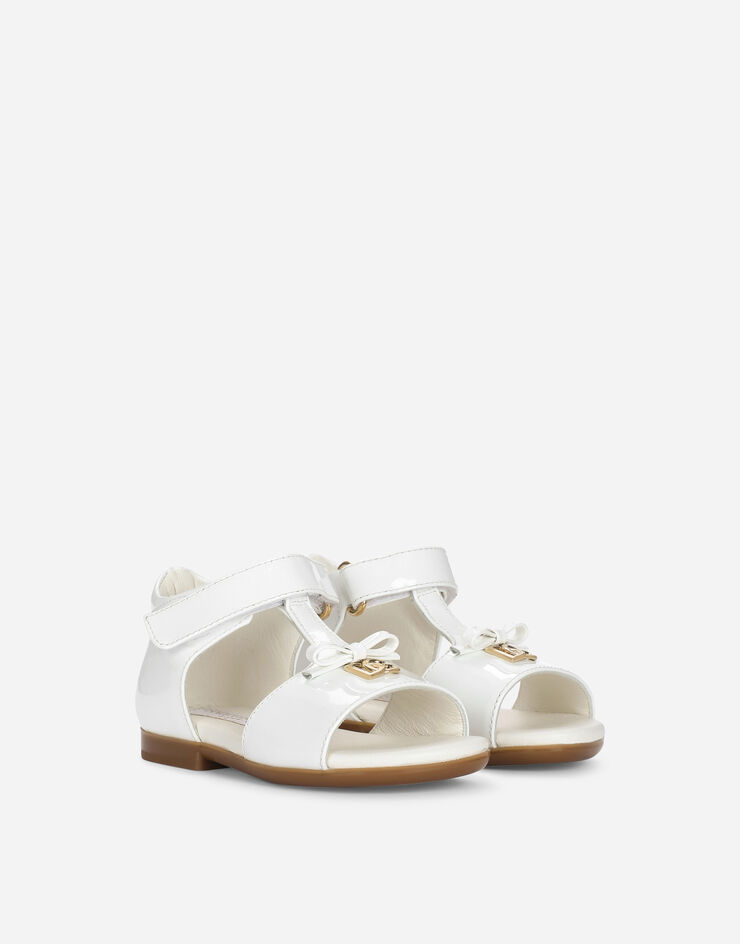 Dolce & Gabbana Patent leather first steps sandals with metal DG logo White D20082A1328