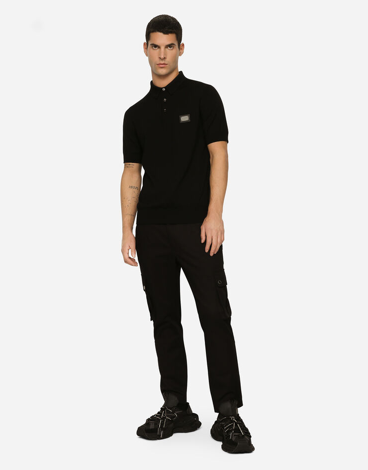 Dolce & Gabbana Maglia polo in lana con placca logata Nero GXO38TJCVC7