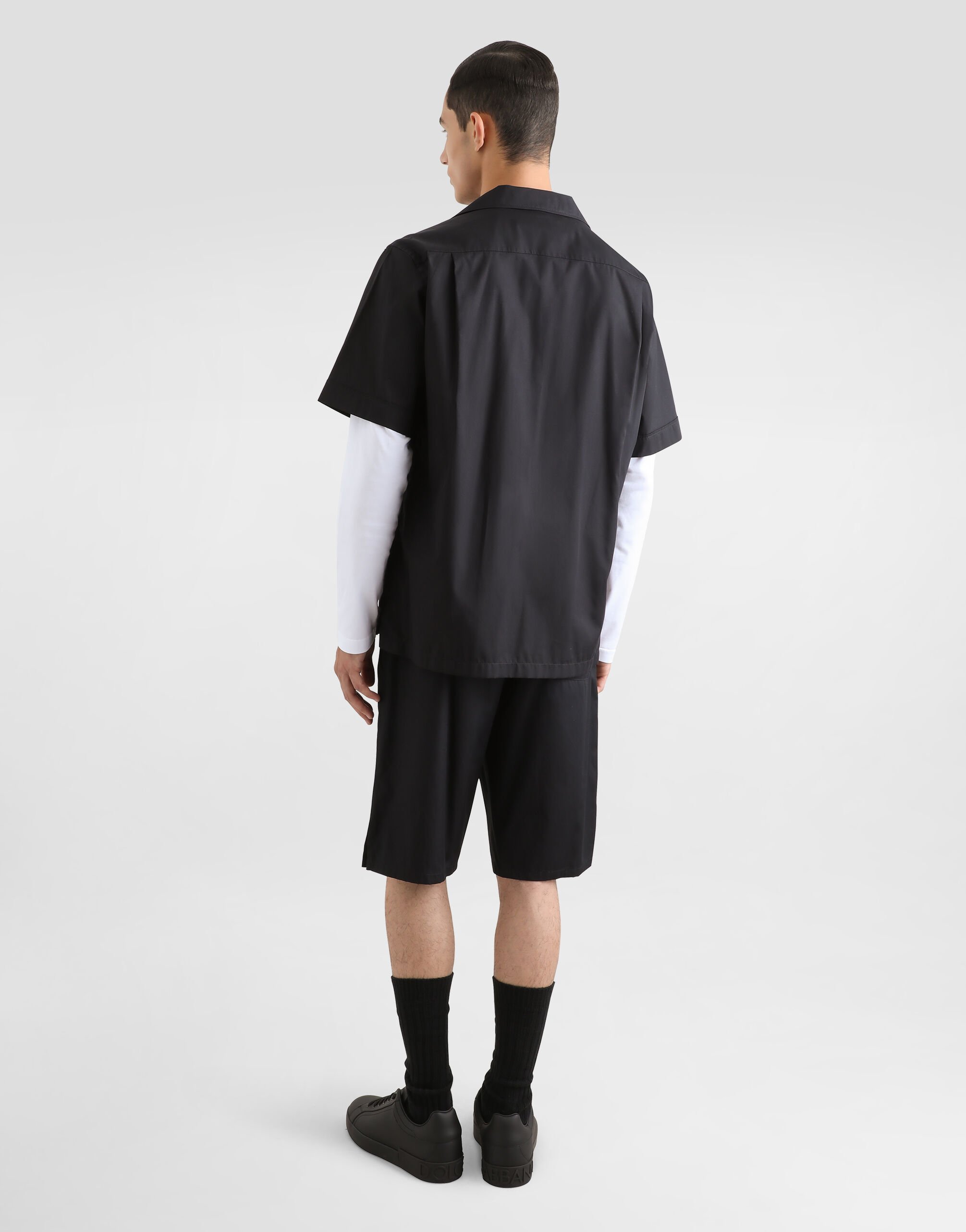 Cotton jogging shorts with logo tag in Black for Men