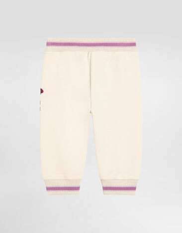 Dolce & Gabbana Pantalon molletonné oversize avec broderie violettes et logo DG Multicolor L2JPC9G7PHT