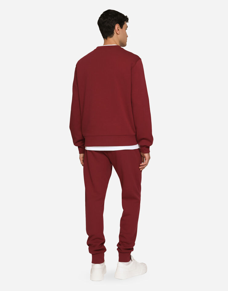 Dolce & Gabbana Pantalon de jogging en jersey à broderie Bordeaux GVF7AZHU7H9