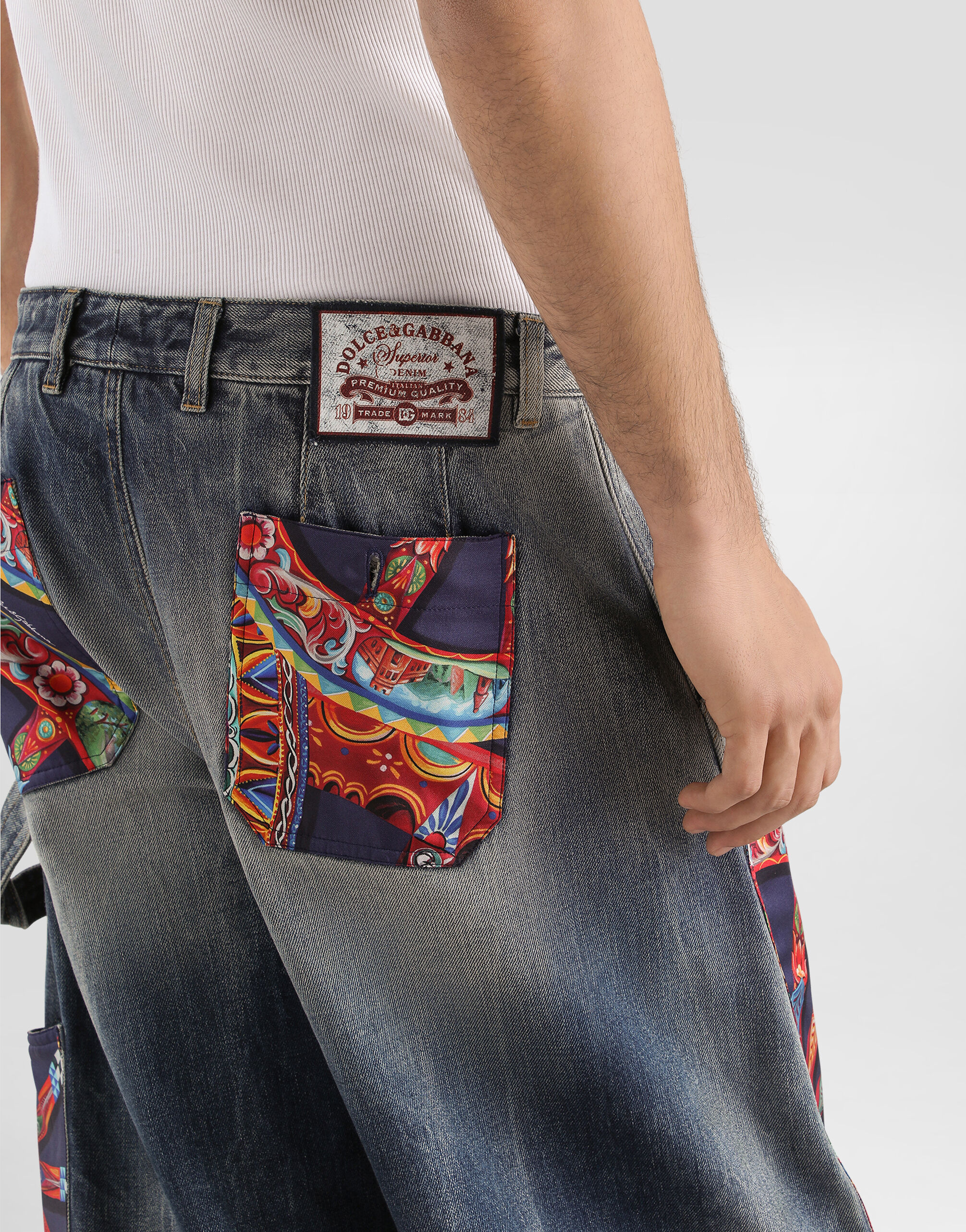 Cotton denim trousers with carretto-print applications in