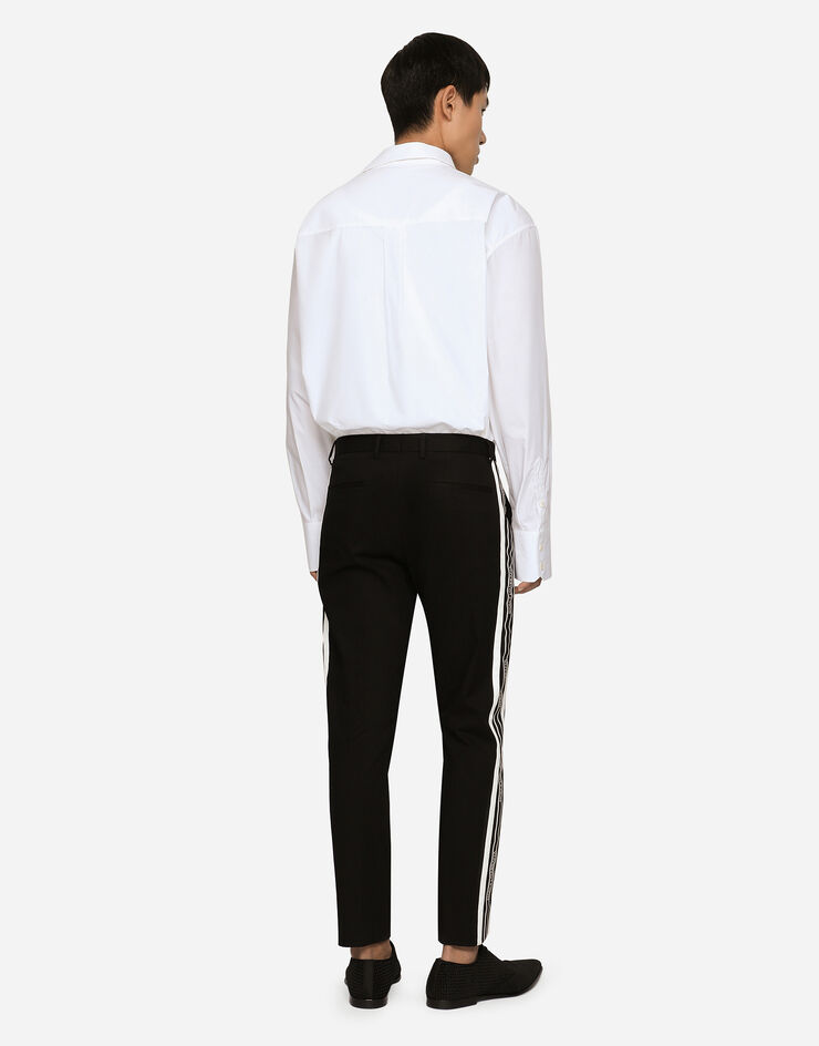 Dolce & Gabbana Pantalon en coton stretch à bandes latérales Noir GVWJETFUFHT