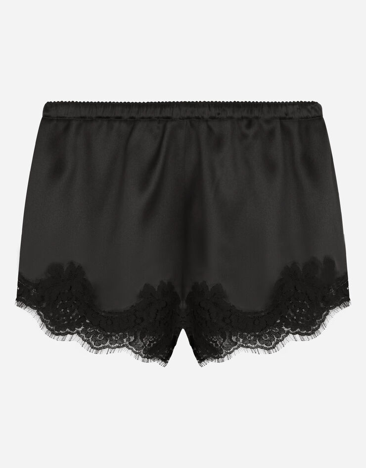 Dolce & Gabbana Diese edlen Dessous-Shorts aus elastischem Seidensatin mit Spitzenbordüre aus Baumwolle bestechen durch ihren sinnlichen; edlen Look. SCHWARZ O3A02TONO13