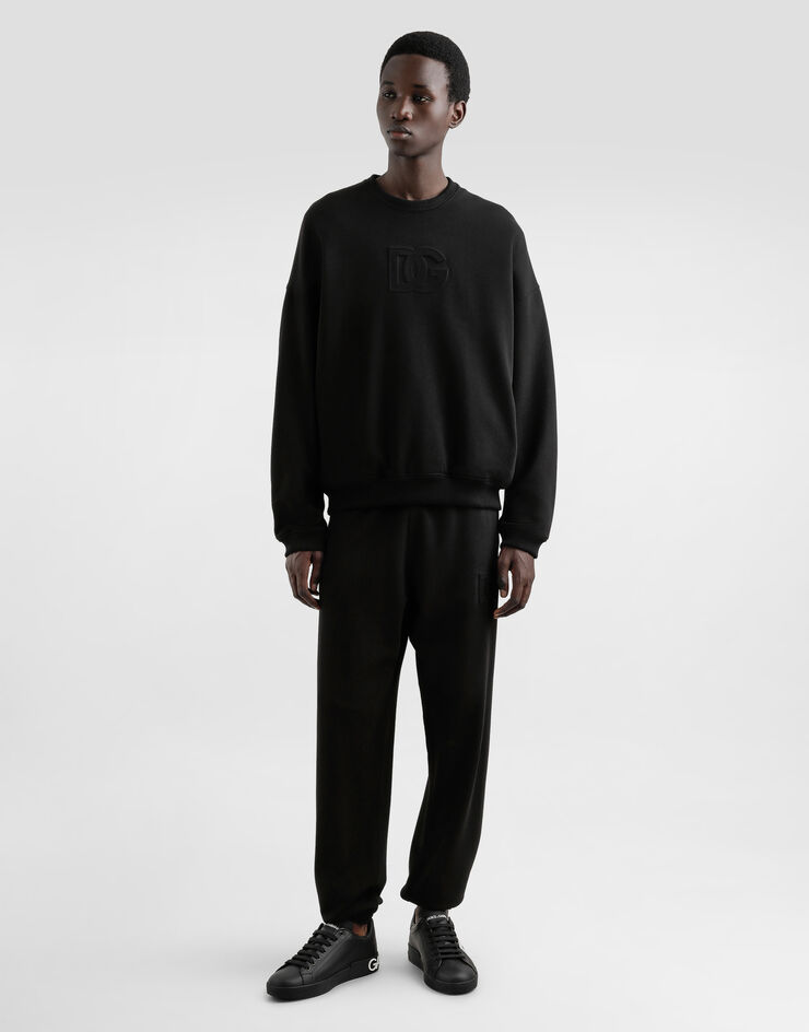 Dolce & Gabbana Jogginghose aus Stretchjersey mit Stickerei Schwarz GP0G4ZG7O2S