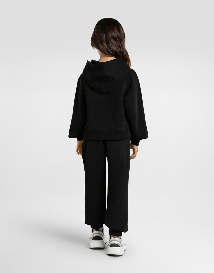 Dolce & Gabbana Oversized fleece trousers with DG logo and rhinestones Black L5JPH1G7PHM