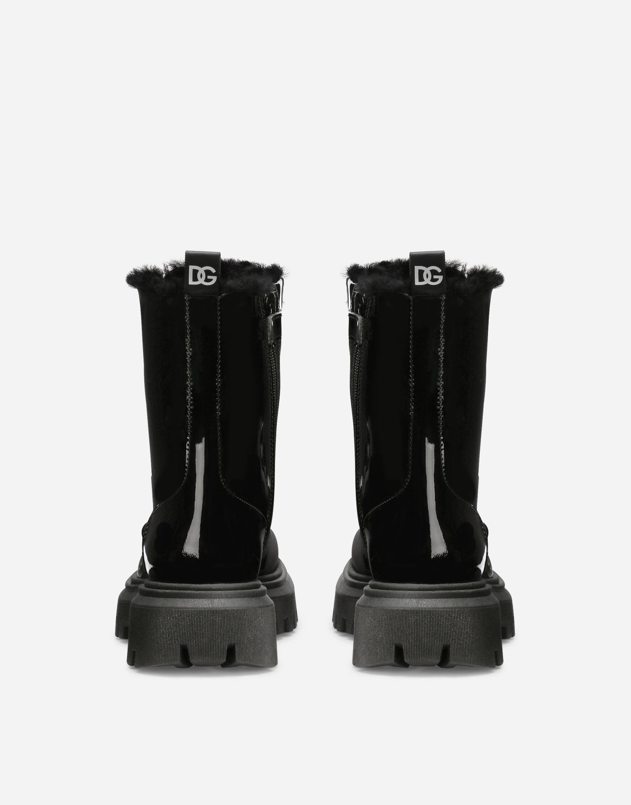 Patent leather combat boots with faux fur lining in Black for