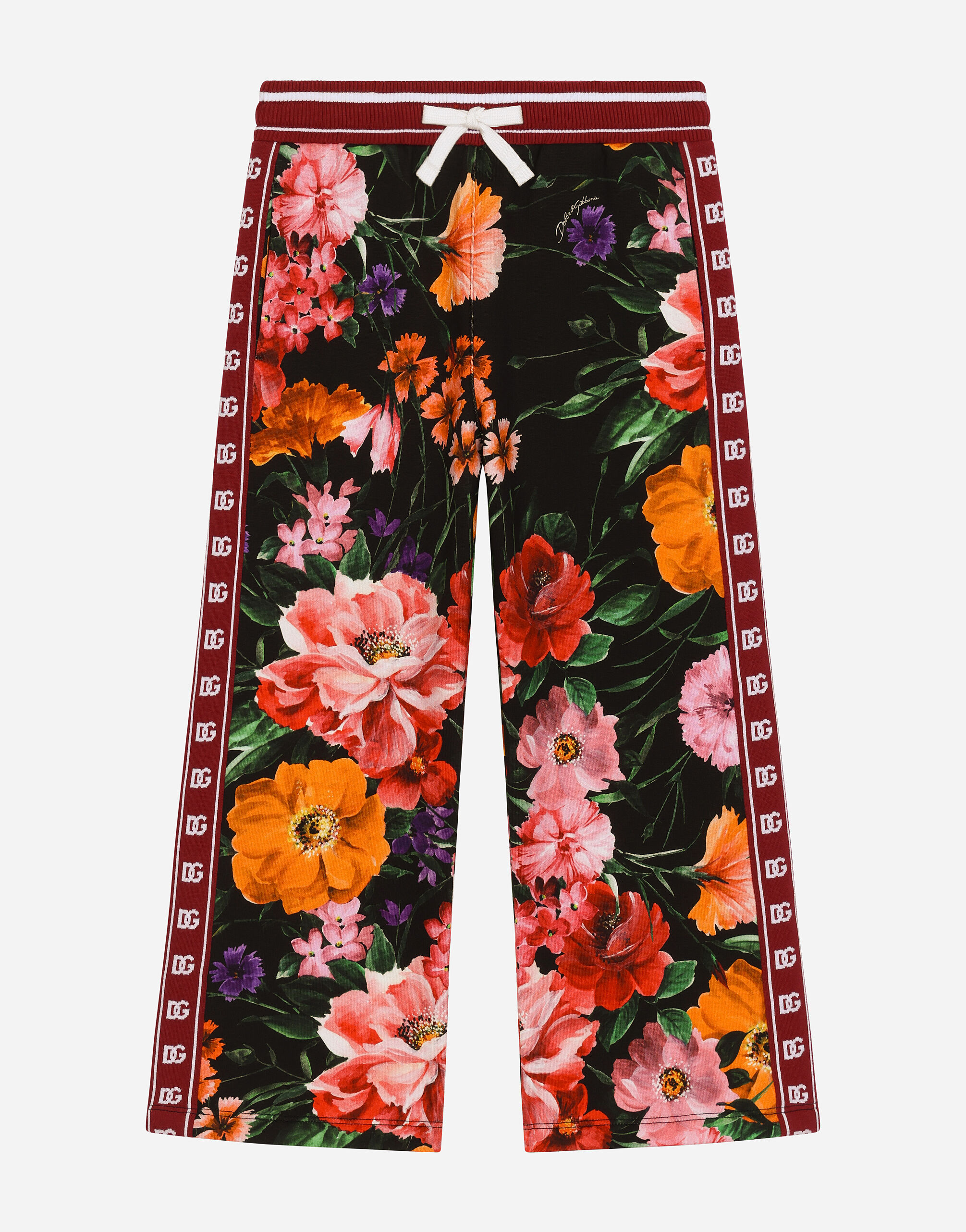 Jersey jogging pants with floral print over a black background in Print for Girls Dolce Gabbana