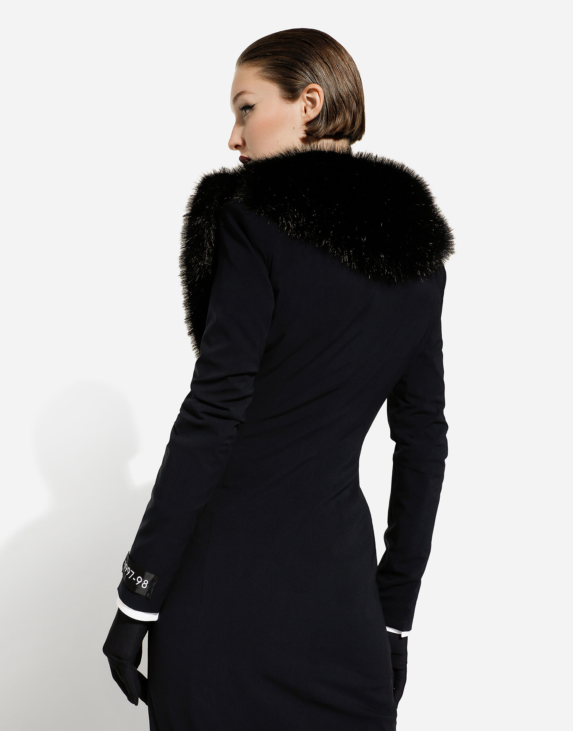 Long silk georgette coat with faux fur collar in Black for