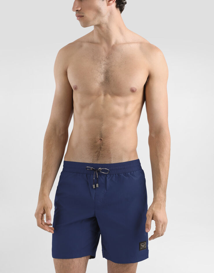 Dolce & Gabbana Mid-length swim trunks with branded plate Blue M4E45TFUSFW