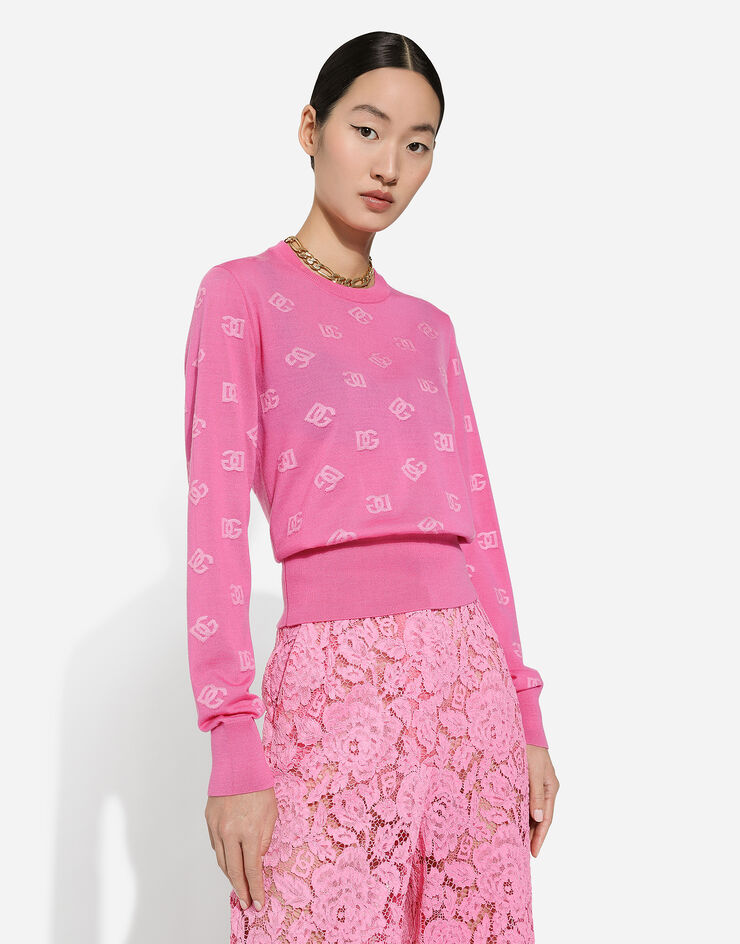 Dolce & Gabbana Jersey de jacquard de lana y seda con logotipo DG Fucsia FXJ34TJEMO9