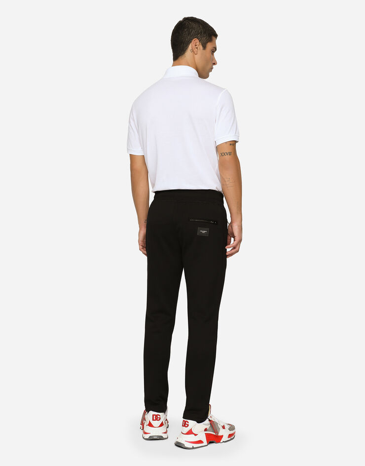 Dolce & Gabbana Pantalon de jogging en jersey avec plaquette à logo Noir GYWEATFU7DU