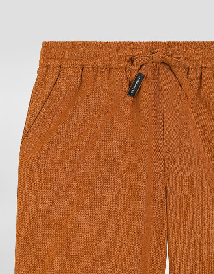 Dolce & Gabbana Cotton and linen canvas bermuda shorts Beige L43Q58LT372