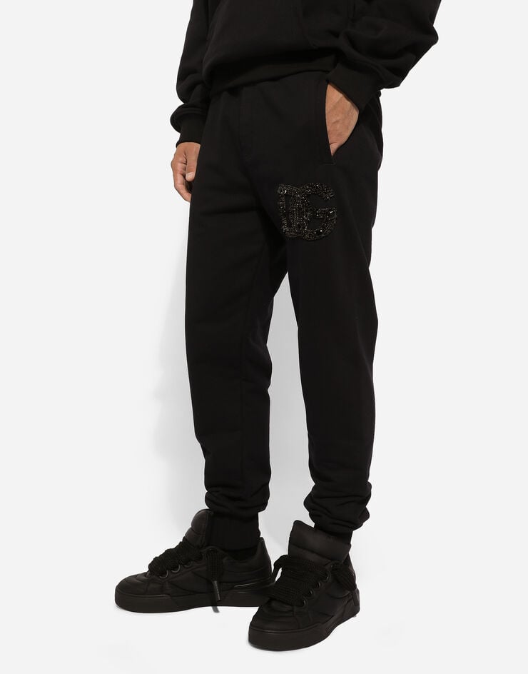 Dolce & Gabbana Jogging pants with rhinestone-detailed DG patch Black GV2VHZG7K4P