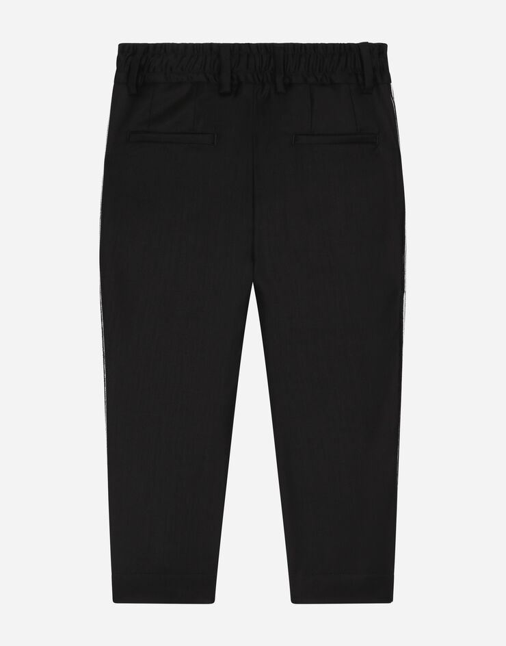 Dolce & Gabbana Stretch woolen pants with logo band Black L44P12FUBFA