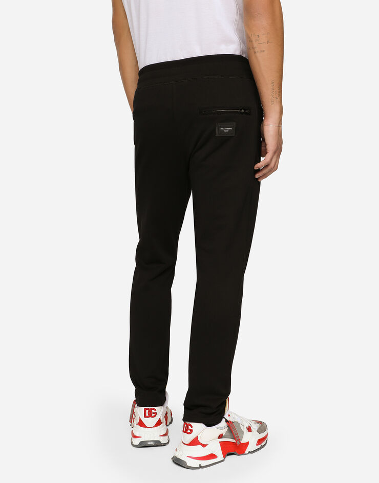 Dolce & Gabbana Pantalon de jogging en jersey avec plaquette à logo Noir GYWEATFU7DU
