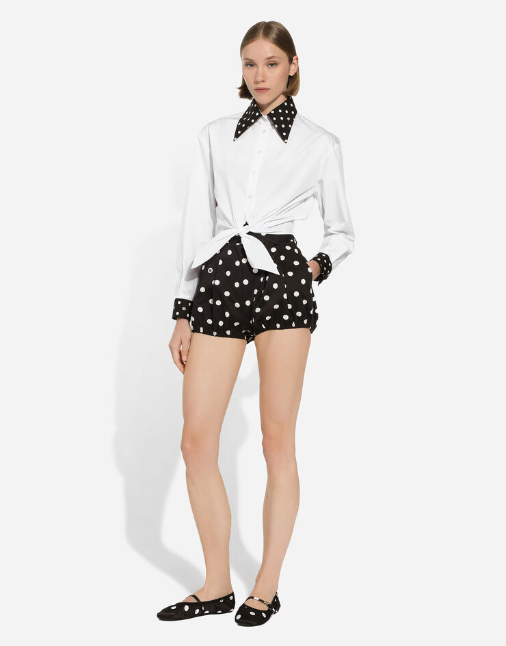 Dolce & Gabbana Camisa cropped con nudo en la cintura de algodón con estampado de lunares Blanco F5P61TGDCMO