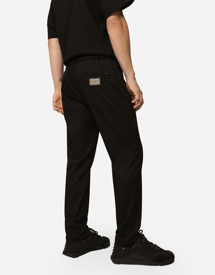 Dolce & Gabbana Pantalón de chándal de algodón elástico con placa Negro GVZAETFUFJR
