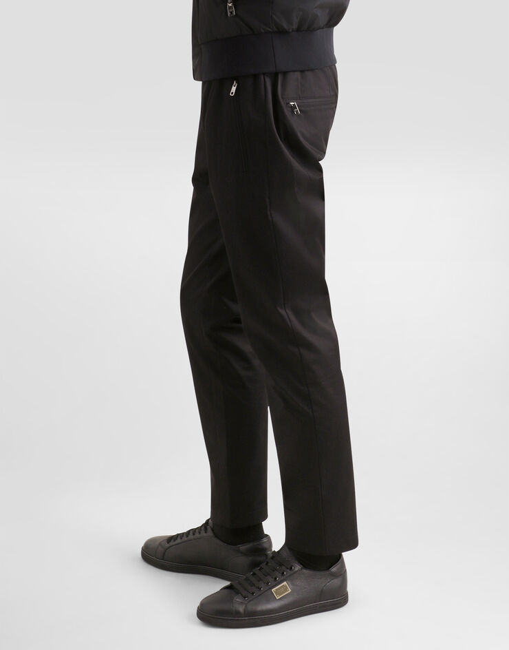 Dolce & Gabbana Jogginghose Baumwollstretch mit Plakette Schwarz GVZAETFUFJR