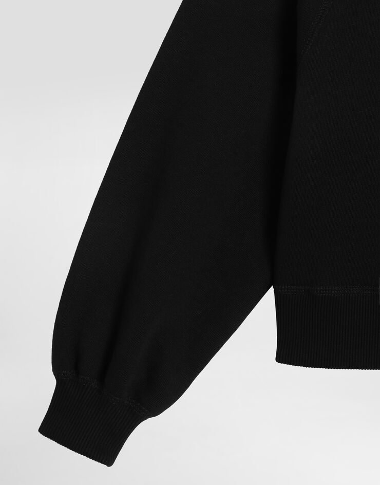 Dolce & Gabbana Oversized hooded sweatshirt with logo and rhinestones Black L5JWCBG7PHM