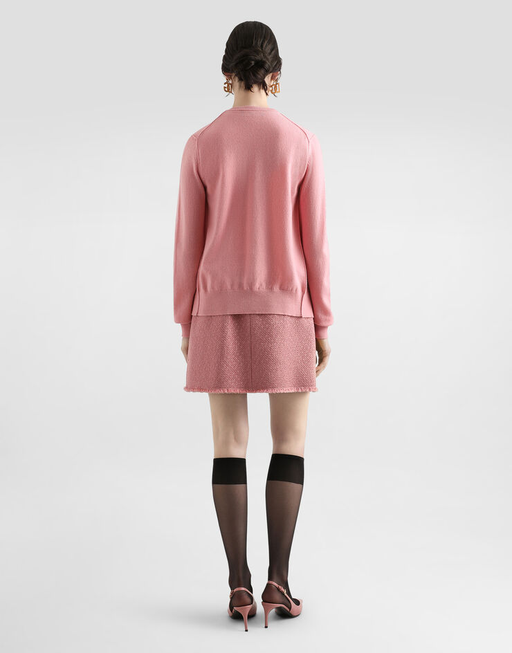 Dolce & Gabbana Kurzer Rock aus Raschel-Tweed mit dekorativen Knöpfen mit DG-Logo Rosa F4C03TGDCYK