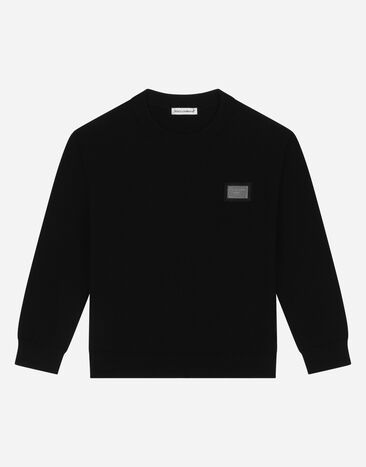 Dolce & Gabbana Round-neck knit pullover with logo tag Pink L5KWM8JBCGC