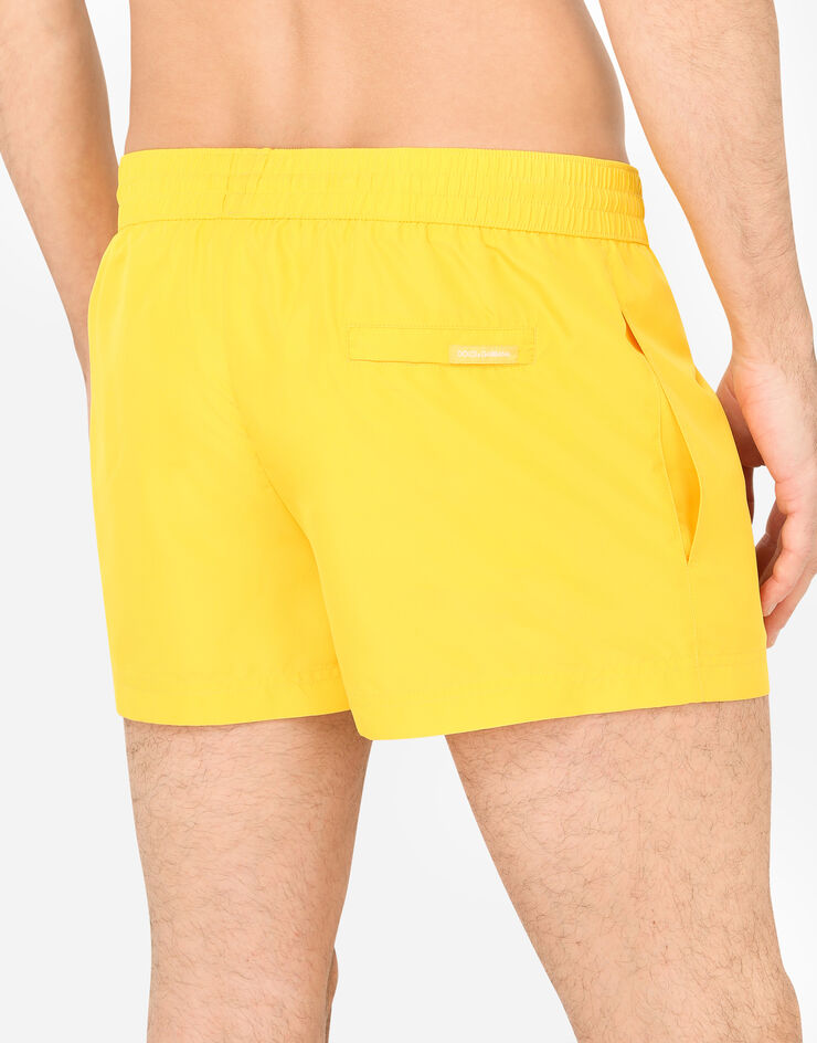 Dolce & Gabbana Short swim trunks with metal DG logo Orange M4B39TFUSFW