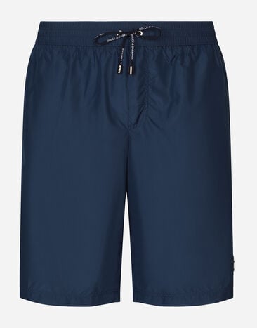 Dolce & Gabbana Mid-length swim trunks with logo tag Blue M4A76JONO05