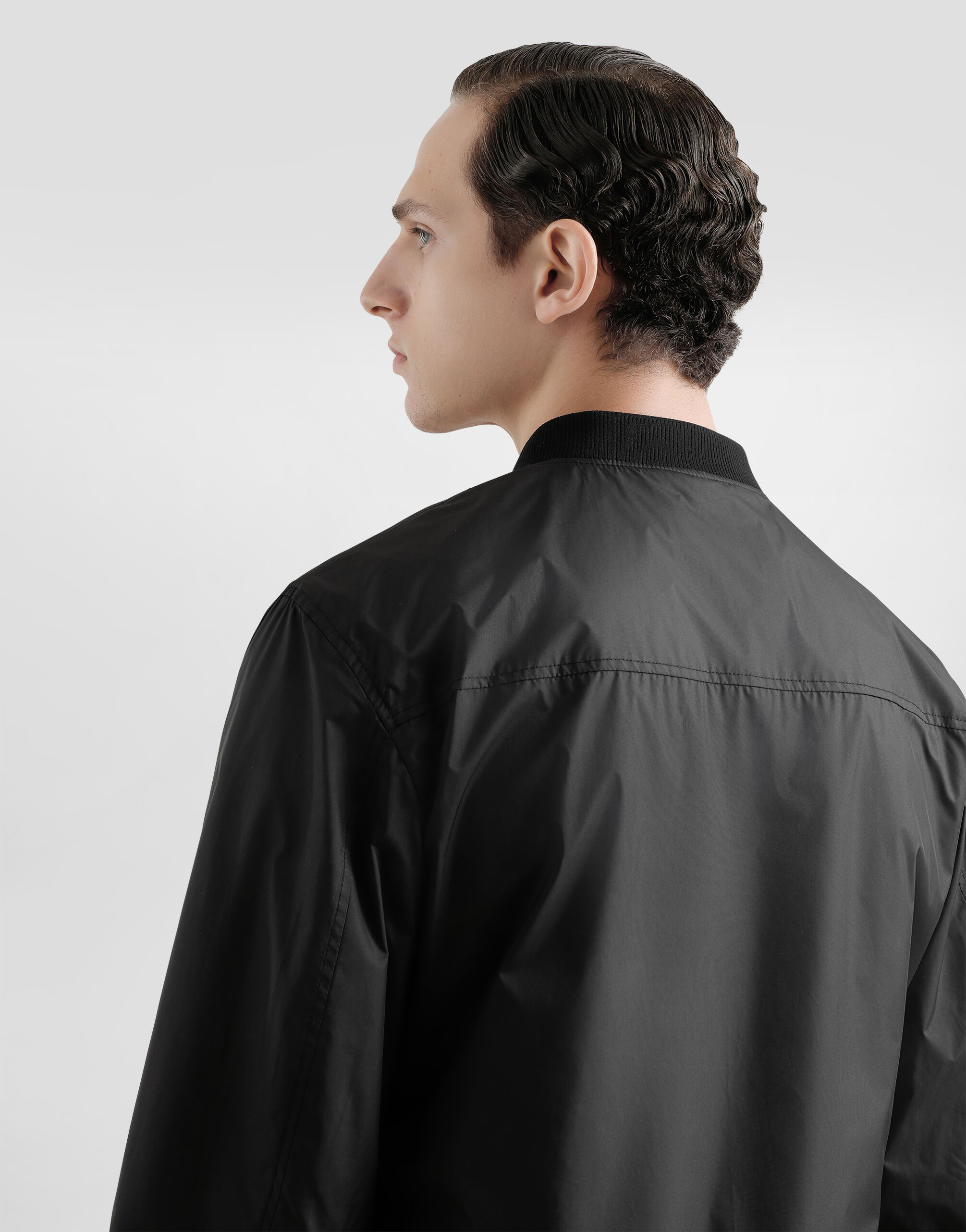 Technical fabric bomber jacket with tag