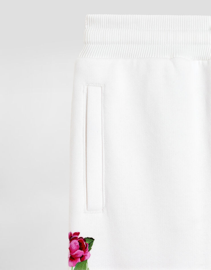 Dolce & Gabbana Fleece jogging pants with flower and DG logo print Print L5JPD7II7GX