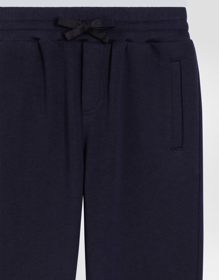 DolceGabbanaSpa Fleece trousers with DG logo plaque Blue L4JPT0G7I2P