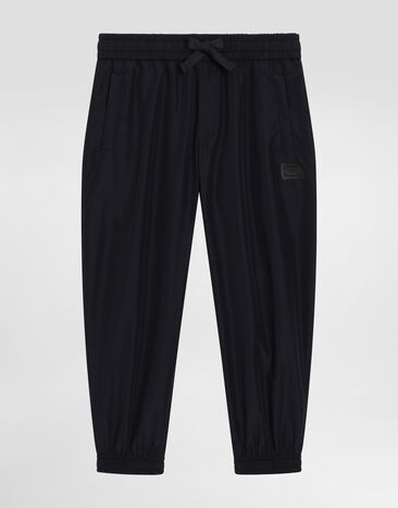 Dolce & Gabbana Nylon-Jogginghose mit Logoplakette Blau L44P87FUS0L