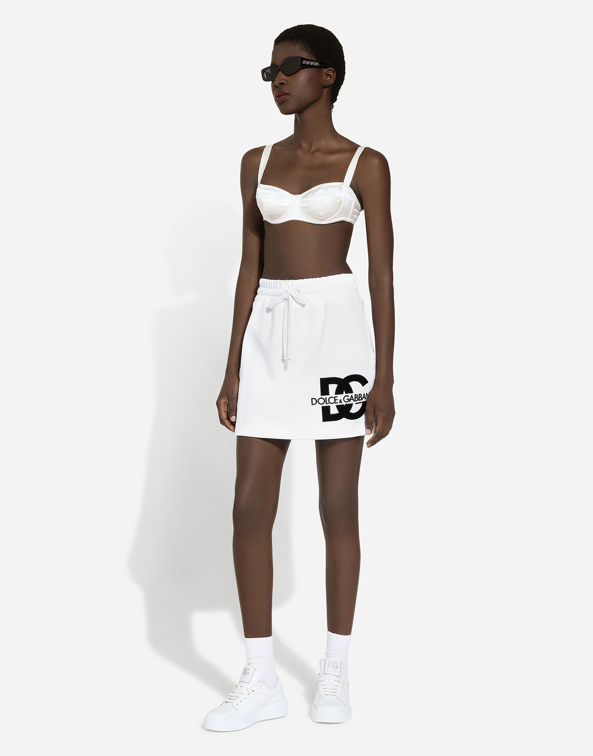 スカート DOLCE GABBANA Women Mid Skirts F4CSKZ GDB7BW0800 White Jersey miniskirt with DG logo patch in White for Women
