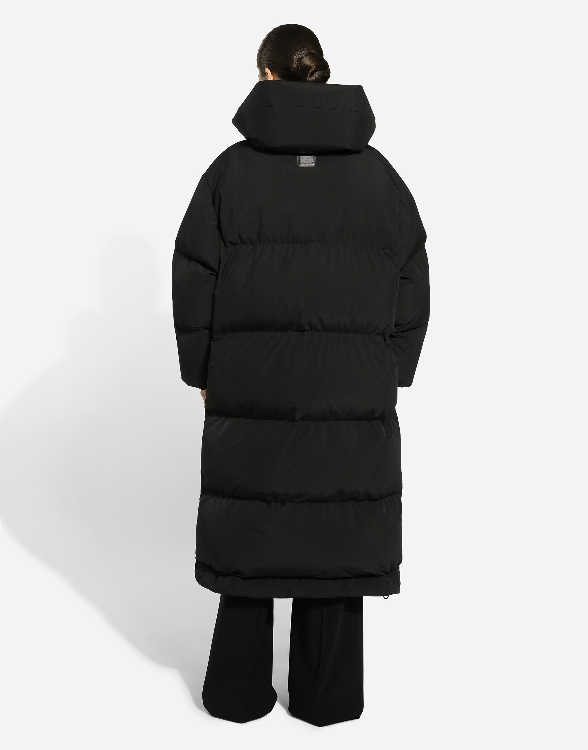 Long padded down jacket with branded tag in Black for Women Dolce Gabbana