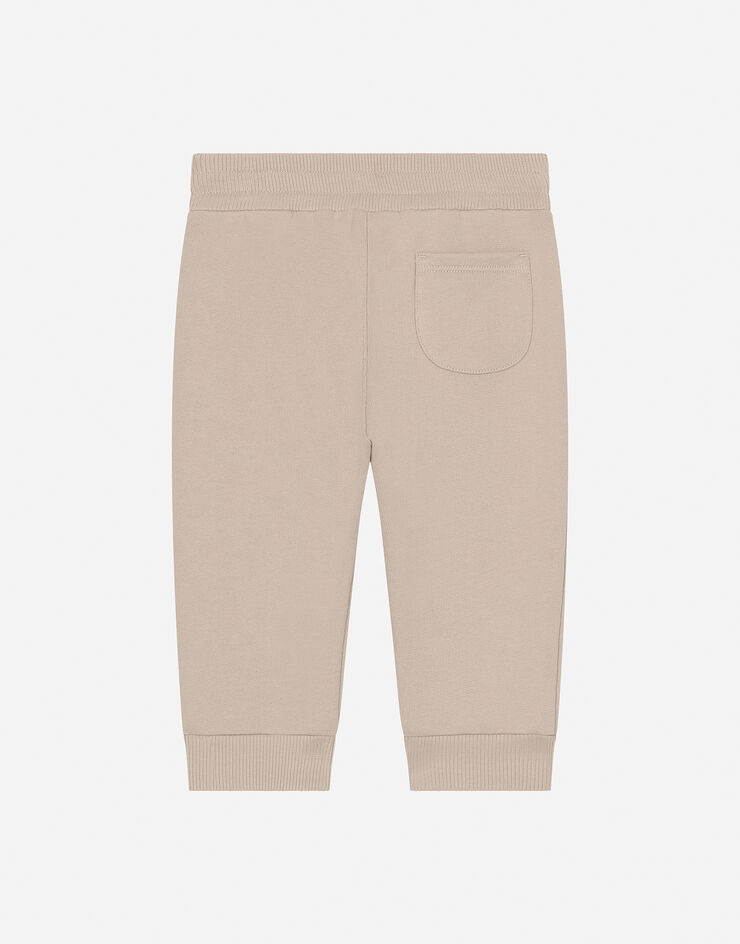 Dolce & Gabbana Pantalón de chándal de punto con logotipo DG Beige L1JPJHG7NXD