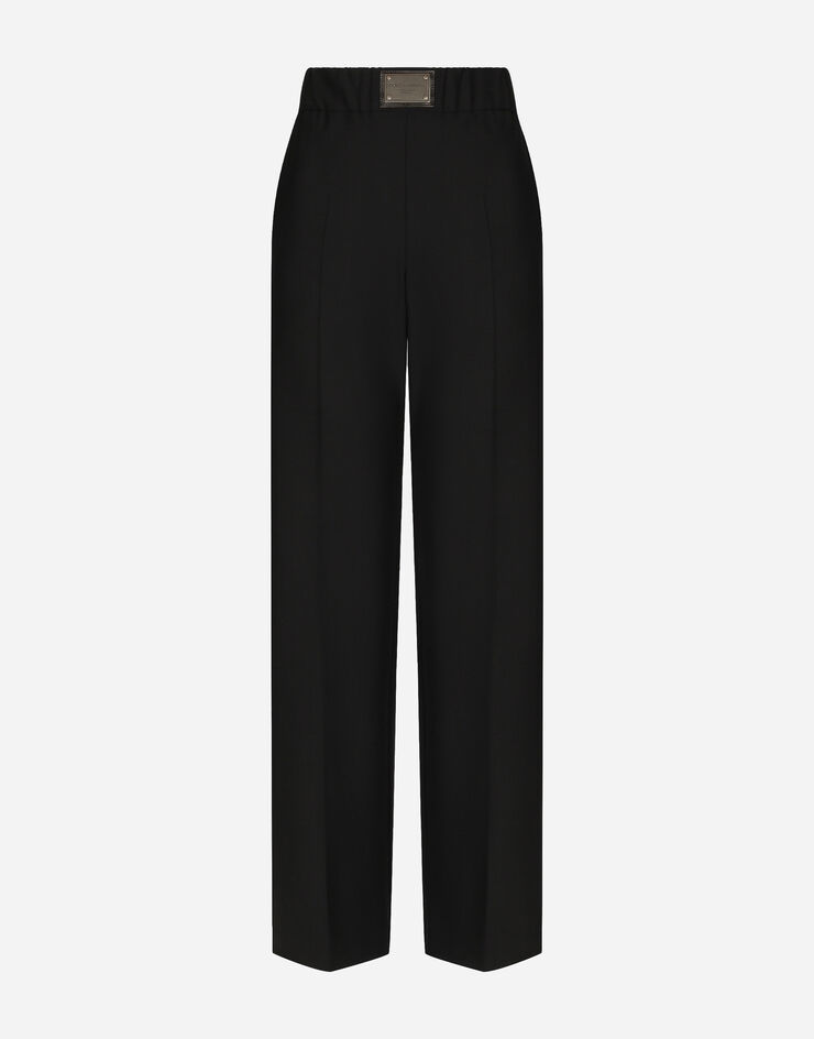 Dolce&Gabbana Ausgestellte Hose aus Wolle mit Logoplakette Schwarz FTCZJTGDBWS