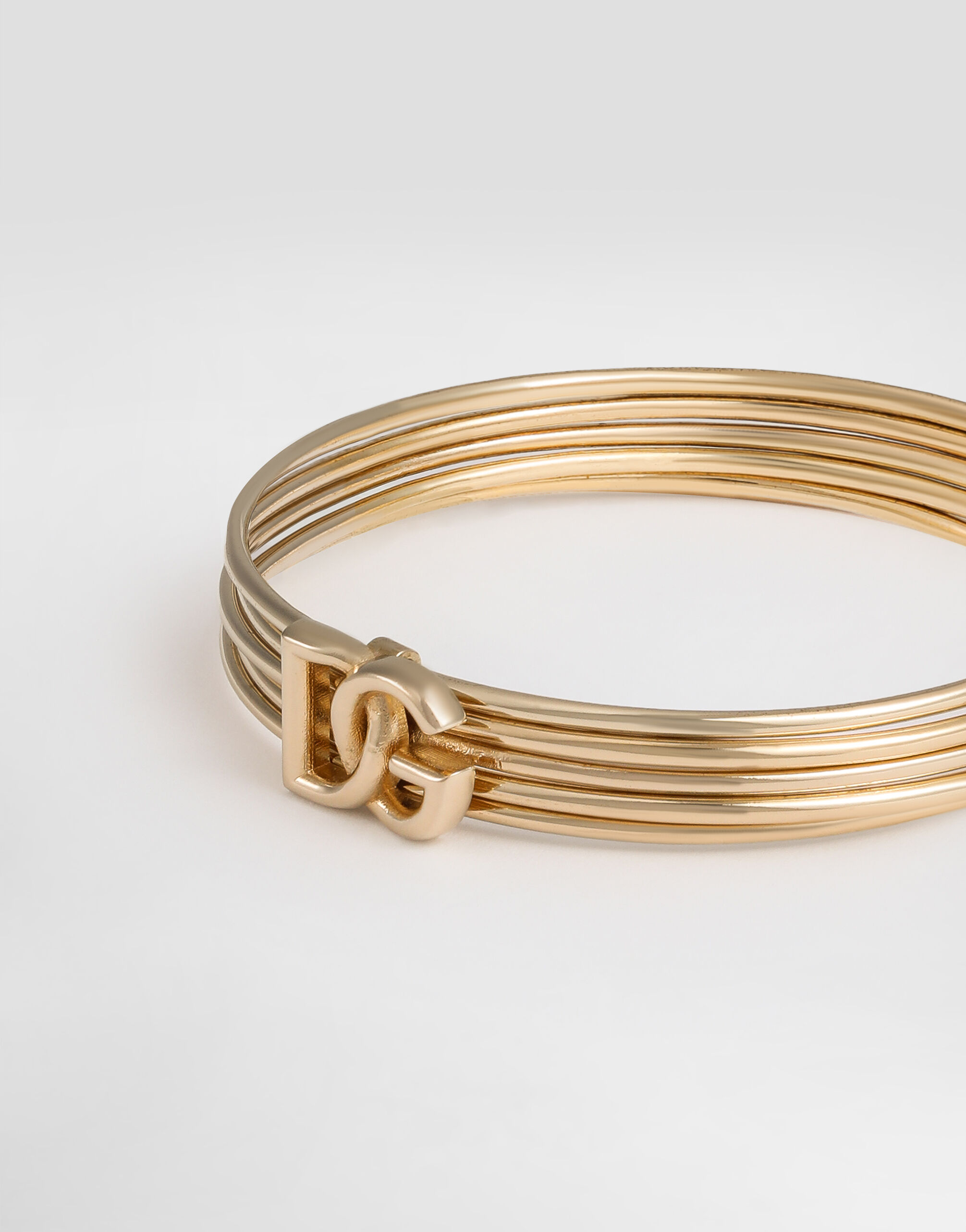 Rigid multi-hoop bangle with DG logo in Gold for Women