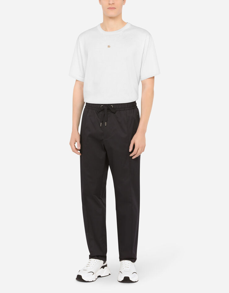 Dolce & Gabbana Stretch cotton jogging pants with plate Blue GYACETFUFJR