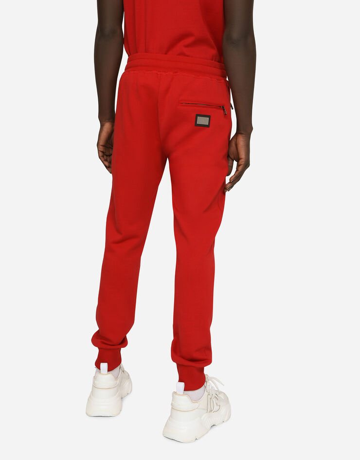 Dolce&Gabbana Pantalone jogging in jersey con placca logata Rosso GVXQHTG7F2G