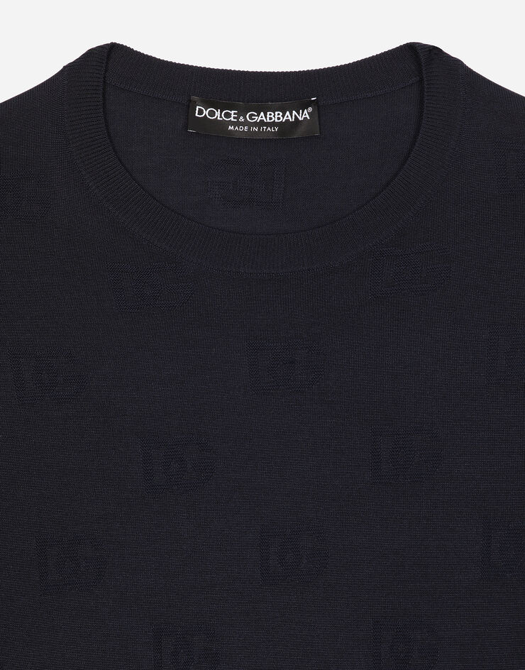 Dolce & Gabbana Jersey de cuello redondo de seda con motivo integral DG en intarsia Azul GXX02TJAST6