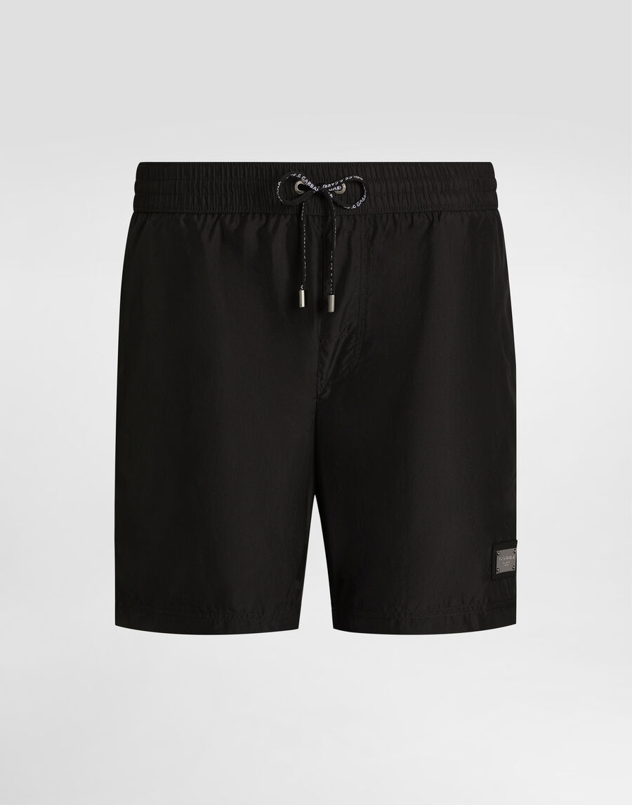 Mid-length swim trunks with logo tag