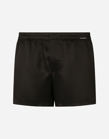 Dolce & Gabbana Shorts aus Seide mit Logoetikett Schwarz M9C03JONN95