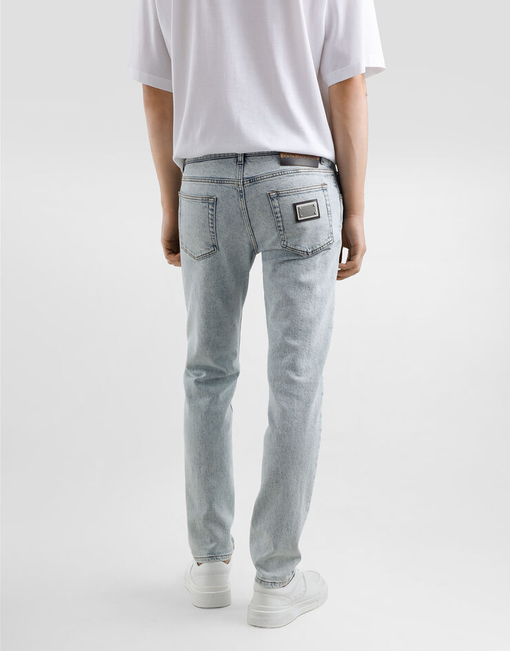 Dolce & Gabbana Jeans Slim aus Baumwollstretch mit Plakette Mehrfarbig GY07CDG8MV2