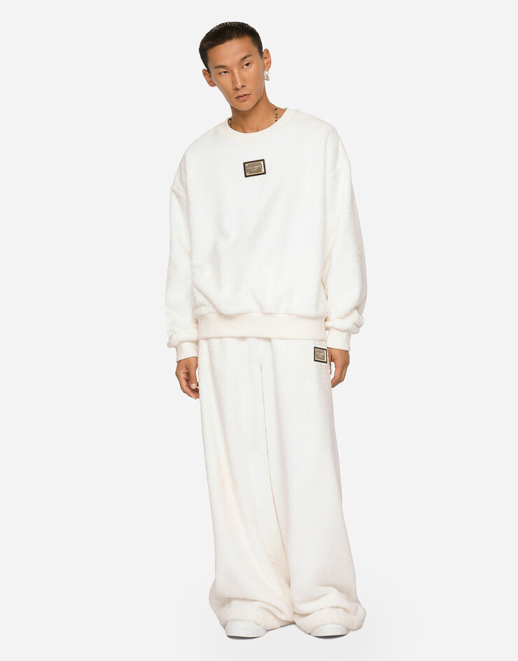 Dolce & Gabbana Rundhals-Sweatshirt aus Frottee mit Logoplakette Weiss G9WU8THU7OC