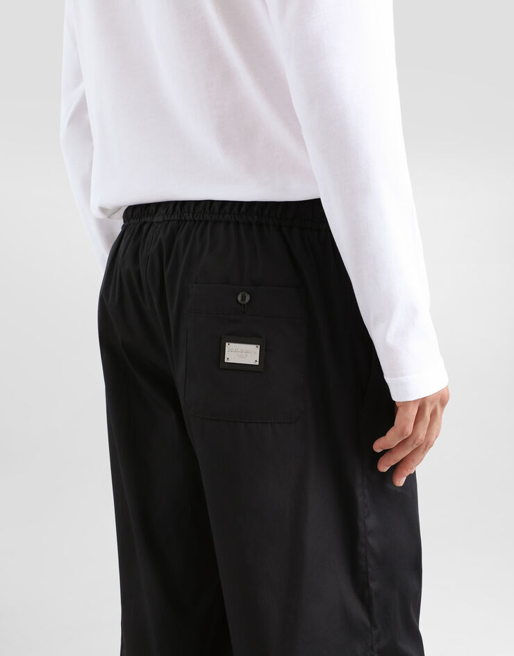 Dolce & Gabbana شورت للركض قطني ببطاقة شعار أسود GV37ATGF855