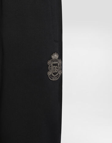 Dolce & Gabbana Jersey trousers with heraldic patch Blue GP07TZG7PZT