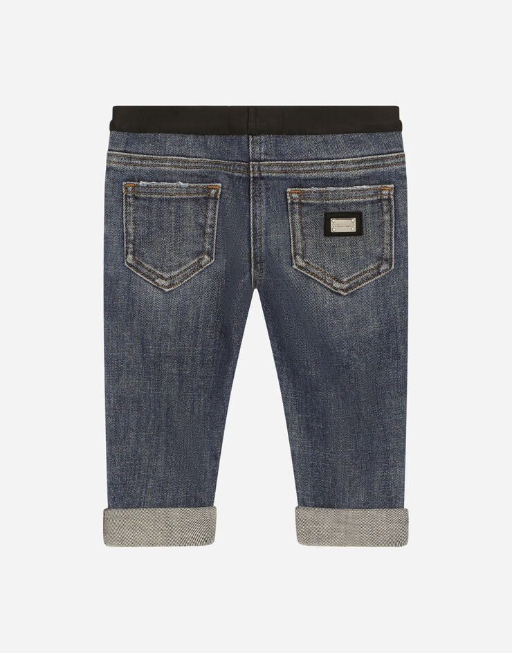 Dolce & Gabbana Vaqueros de denim elástico con logotipo en cintura elástica Azul L22F48LDA66